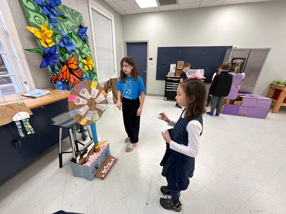 Students at cardboard arcade